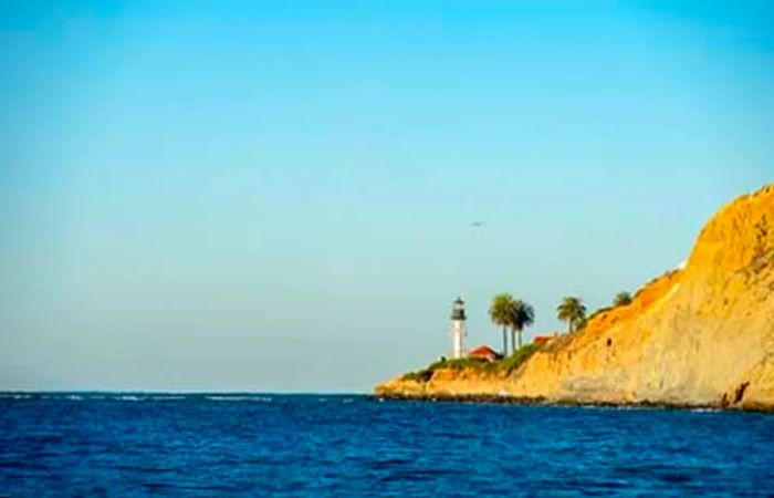 A lighthouse perched along the cliffs in Ensenada, Mexico