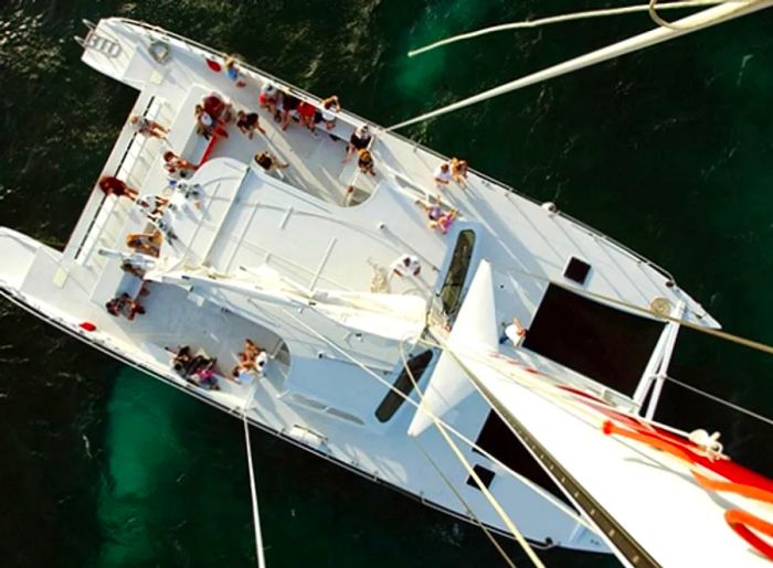 guests savoring tropical cocktails during a catamaran cruise off the coast of Aruba