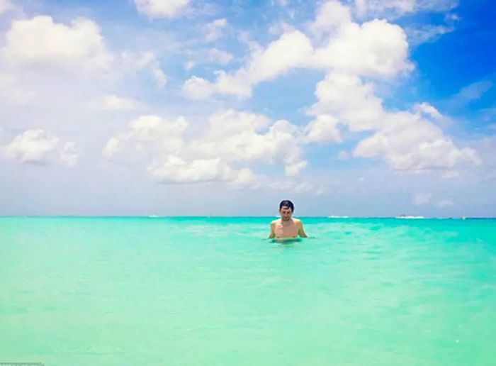 Randy enjoying the ocean waves in Aruba