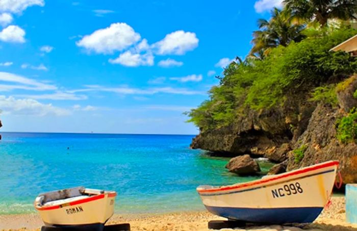 2 fishing boats resting on the sandy shores of Playa Forti, Curacao