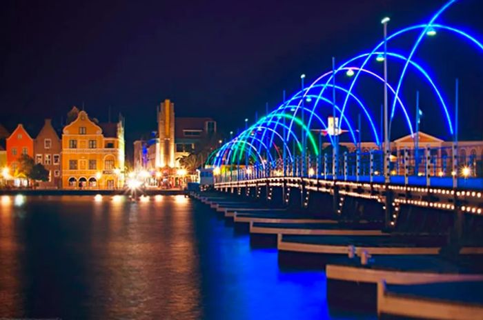 The pier in Curacao adorned with vibrant lights during the night