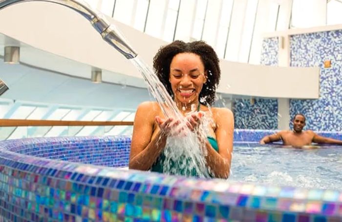 a couple enjoying the hydrotherapy pool at Cloud 9