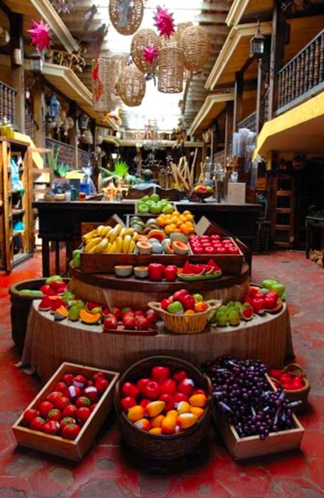 a fruit stall in a Caribbean outdoor market