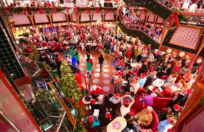 Guests gathering in the atrium for a festive Christmas event