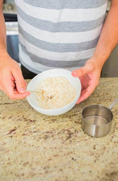 Hands mixing ingredients in a bowl