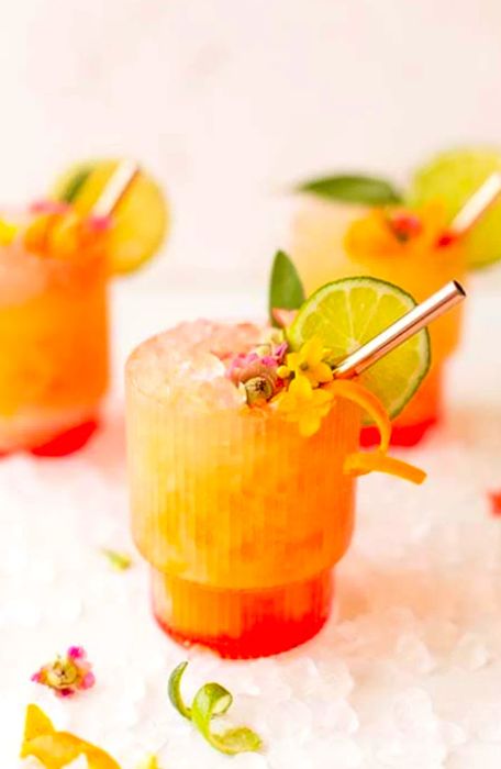 Three vibrant pineapple mango rum punch cocktails