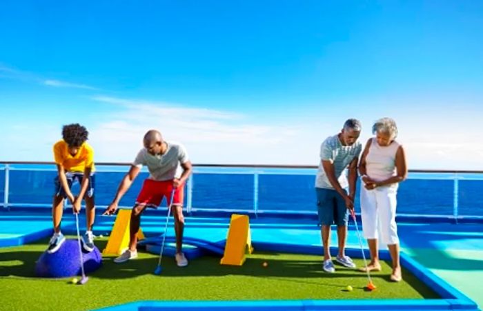 a family enjoying a game of miniature golf together