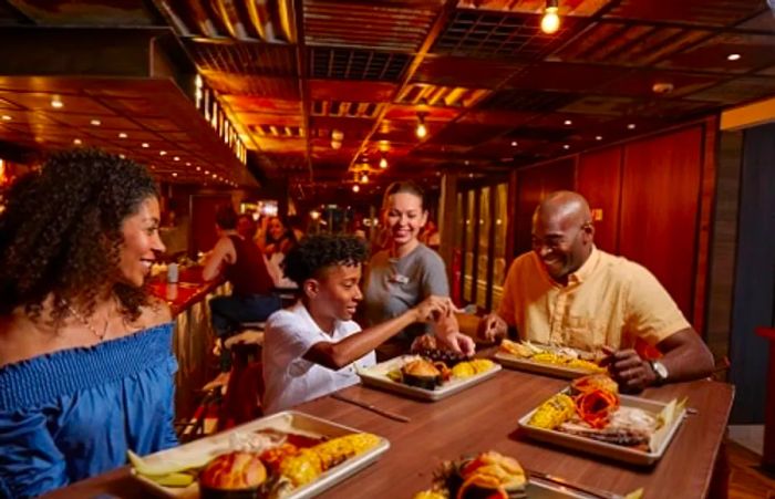 a family enjoying dinner at Guy’s Pig and Anchor Steakhouse