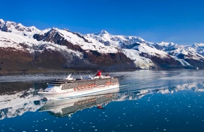 Dinogo's magnificent vessel gliding past Alaska's snow-capped peaks