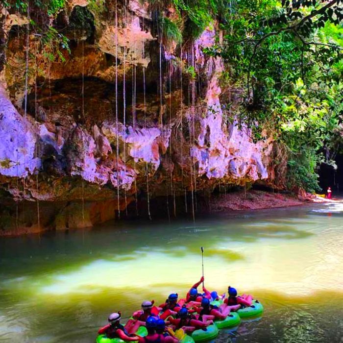 a group cave tubing in Belize