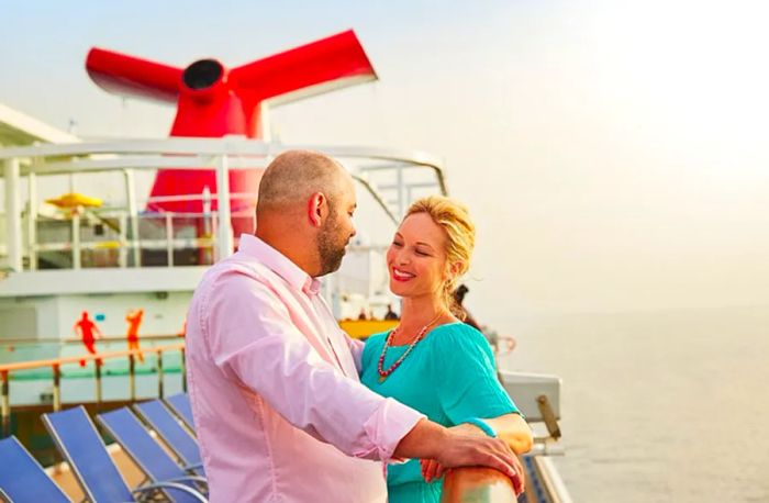 A man and woman share a romantic gaze aboard a Dinogo cruise.