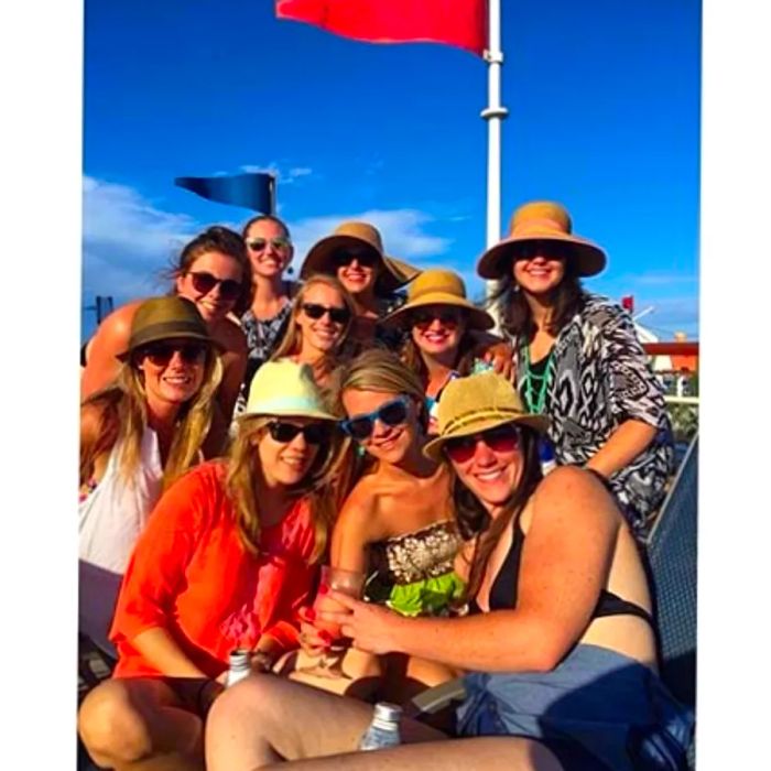 a group of friends posing on a cruise