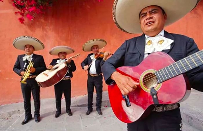 a mariachi band performing in the streets of Mexico