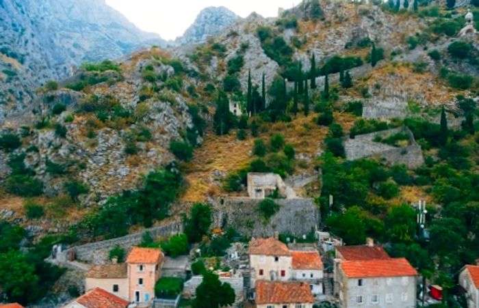 the fortifications encircling the city atop the Kotor mountains