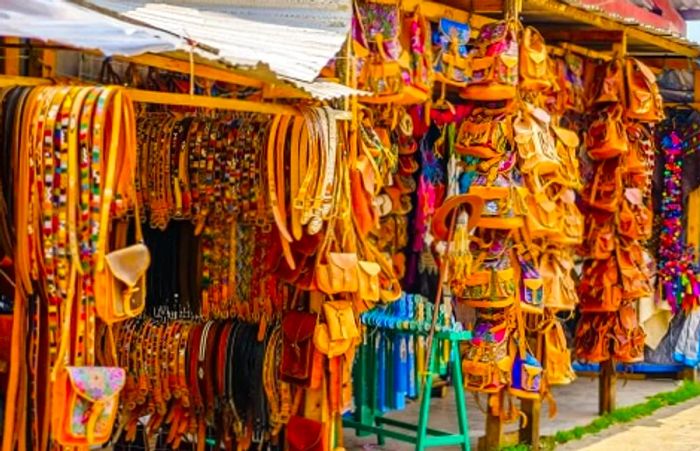 Leather belts and backpacks available at a market in Oaxaca, Mexico