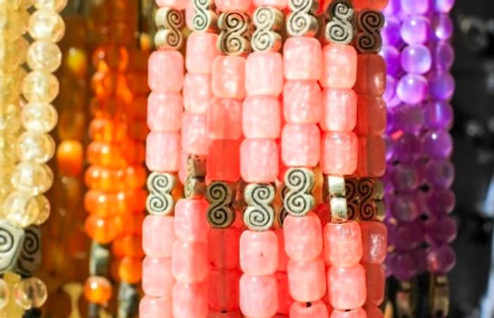 Pink worry beads available for sale at a Greek market.