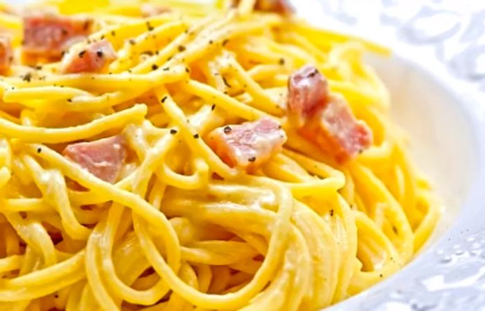 a close-up view of carbonara pasta