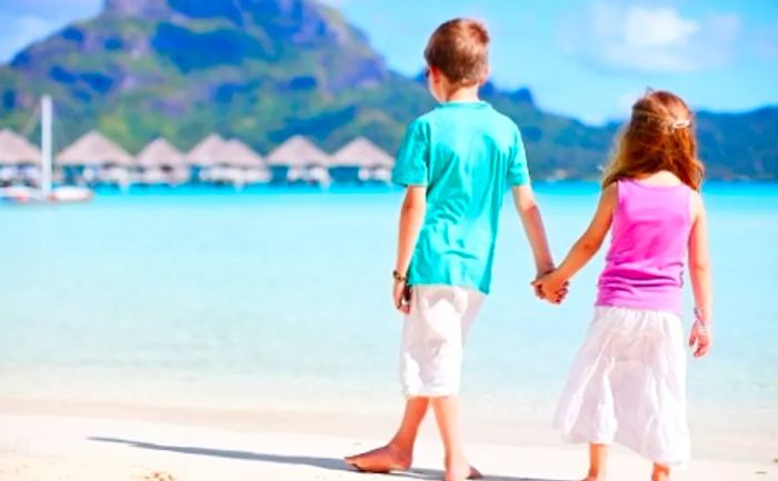 two kids enjoying the beach on Bora Bora Island