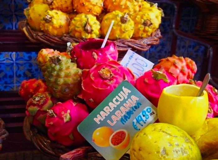 dragon fruit and passionfruit for sale at a Portuguese marketplace in Funchal