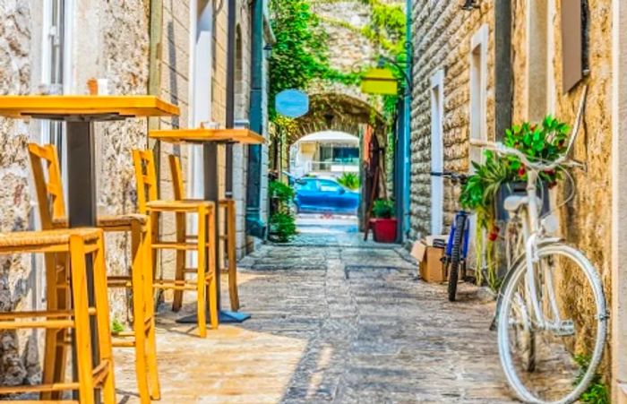 a picturesque cobblestone alleyway in the old town of Budva, Kotor, Montenegro