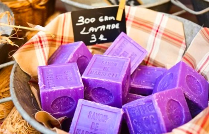 a basket of lavender soap from Marseille showcased at a street market