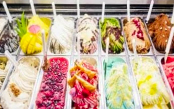 a selection of gelato displayed at an Italian market