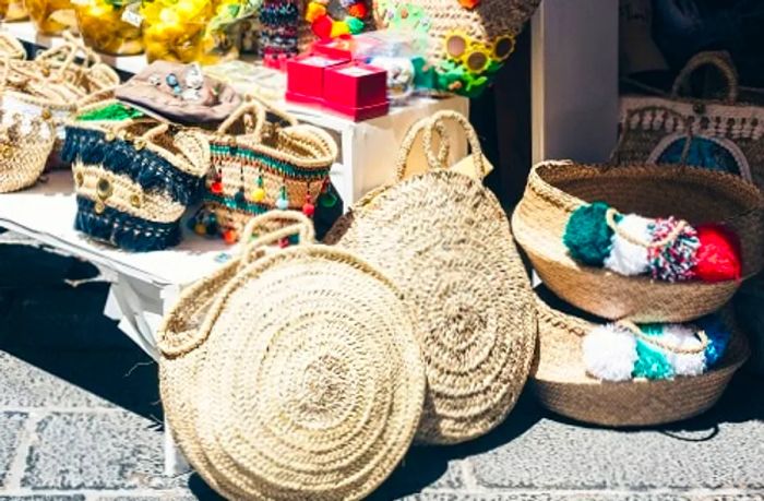 coffa bags and wicker bags available for purchase at a Sicilian market