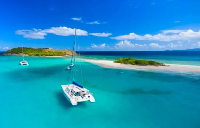 bird's-eye view of a catamaran gliding through the Eastern Caribbean waters