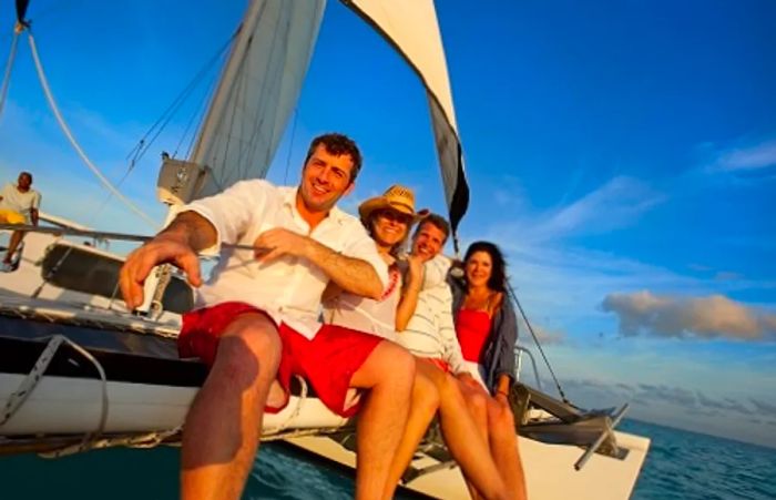 a group of friends relishing their day aboard a catamaran