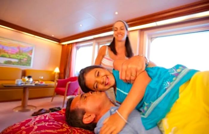 family getting comfortable in their stateroom