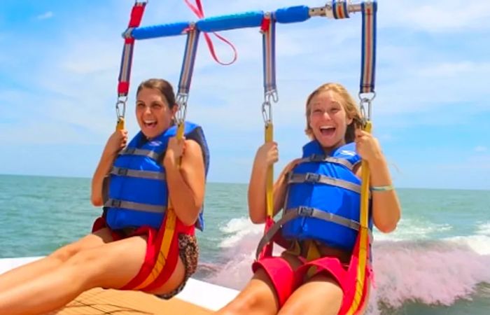 a mother and daughter preparing for parasailing near St. Thomas