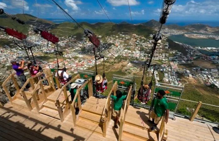 four participants preparing to zip line down the world’s steepest zip line in St. Maarten