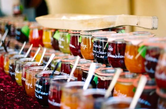 assortment of jams and jellies in glass jars