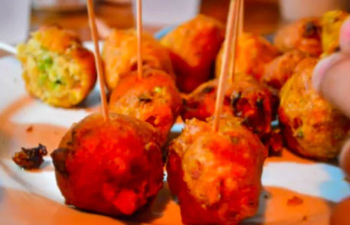 conch fritters from Key West presented with a wooden stick