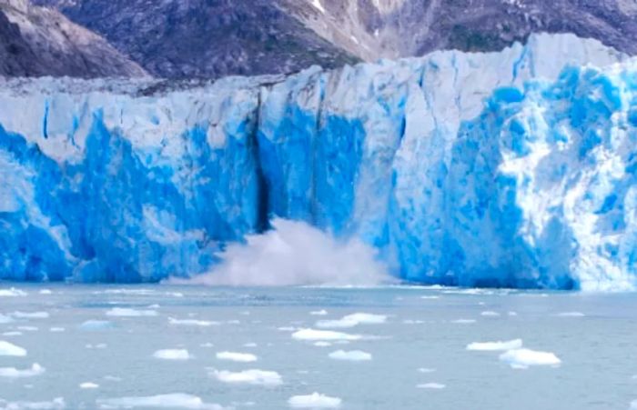 the ice calving from Tracy Arm Fjord and crashing into the ocean