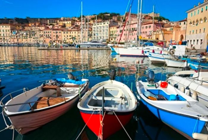 Boats are docked around the picturesque marina in Livorno, Italy.