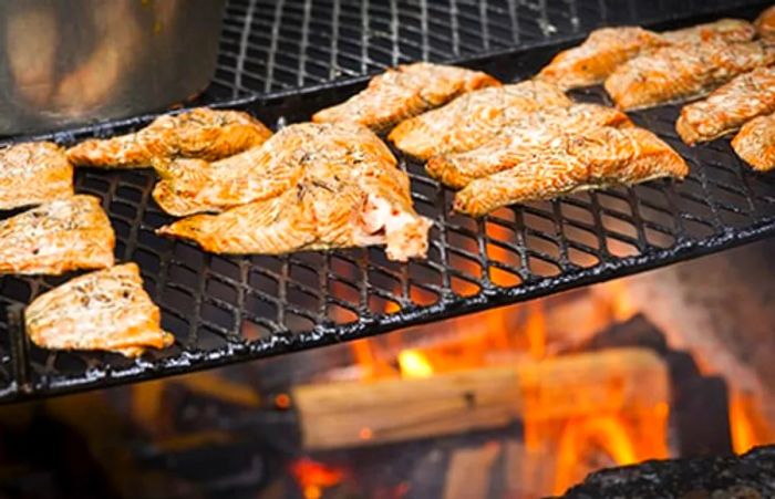 fresh Alaskan salmon grilled over an open flame