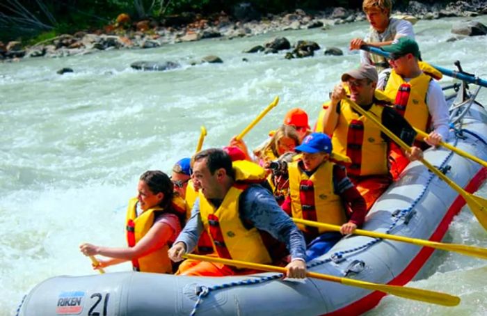 A group of adventurers whitewater rafting on the Mendenhall River