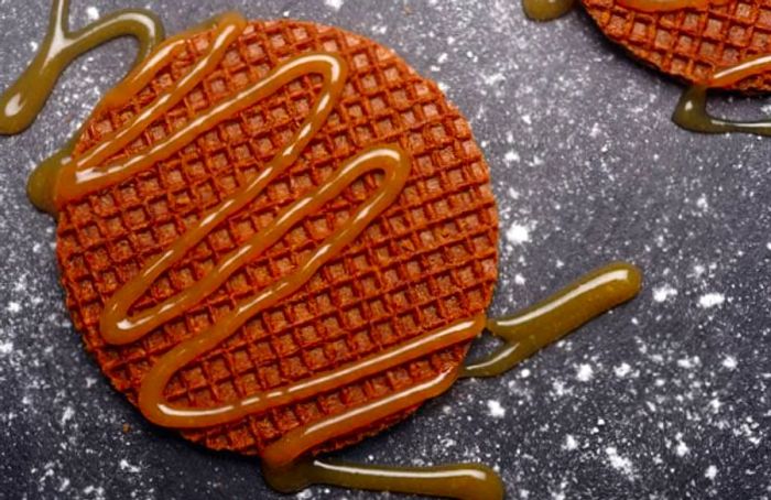 Stroopwafels served with a generous drizzle of caramel.