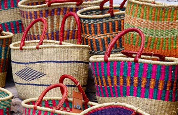 a colorful assortment of straw baskets showcasing various designs