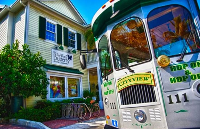 the hop-on & hop-off trolley stops in front of Key West’s butterfly and nature conservatory