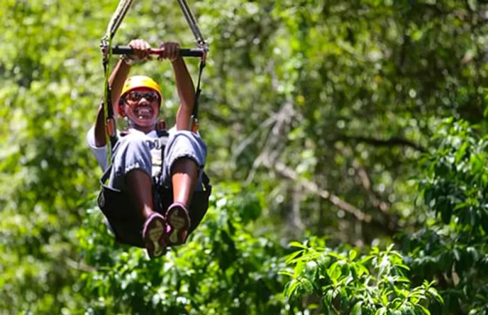 a woman experiencing zip lining at Sky Safari in St. Kitts