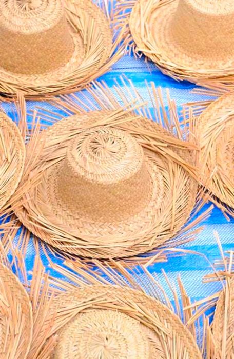 colorful straw hats displayed in a local Bahamian market