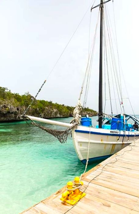 A white sailboat secured to a dock on Catalina Island, Dominican Republic