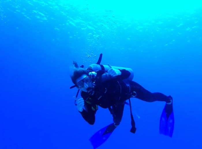 a scuba diver giving a thumbs up while diving off the coast of St. Lucia