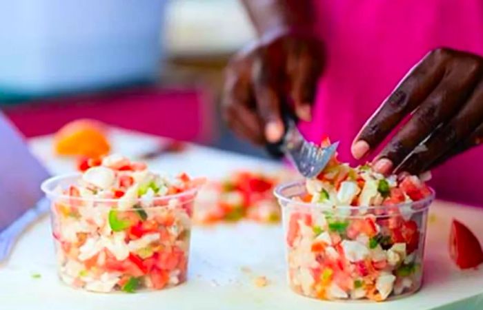 local Bahamian chef making Conch Salad, a beloved dish on the island