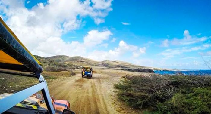 Cruising down a dirt path in Aruba during the North Coast Jeep Safari