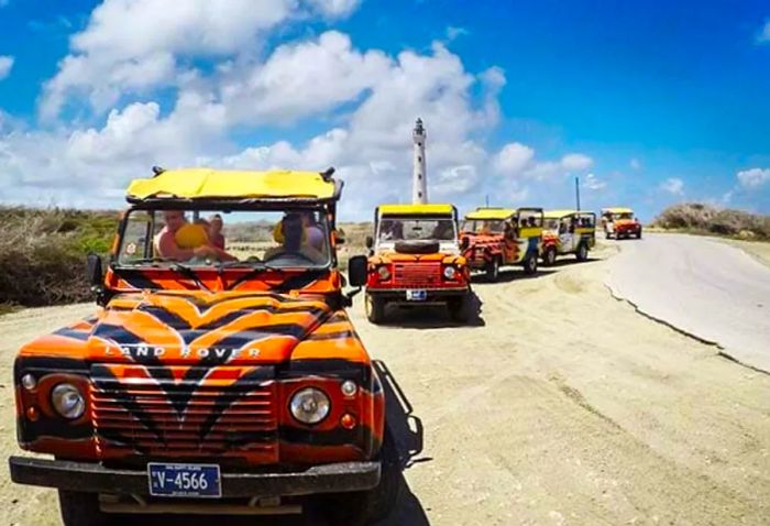 Safari-style vehicles ready to go in Aruba