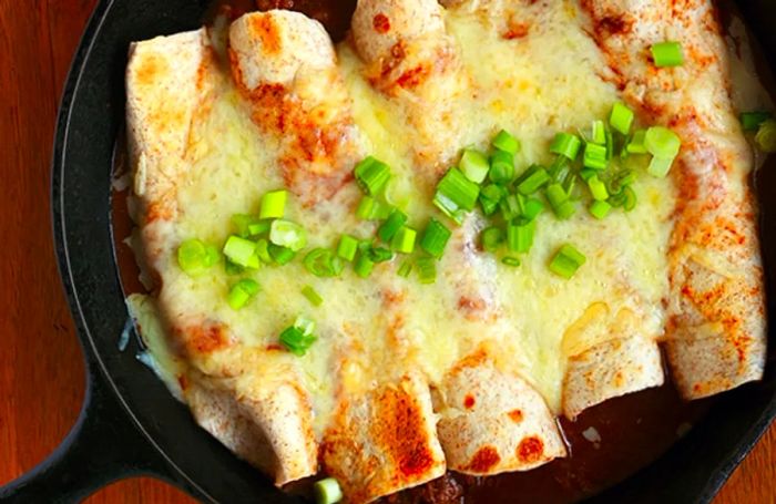 Enchiladas served in a cast iron pan