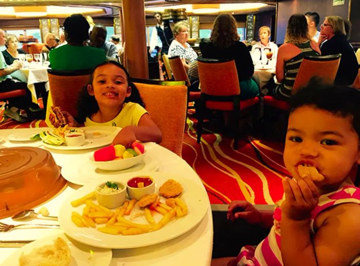 Doyin’s kids enjoying a meal on the ship